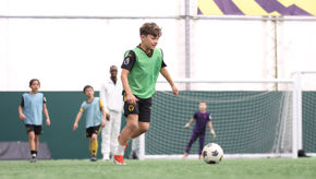 Boy In Uk With Green Bib