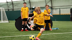 Boy Home Kit Kicking Ball