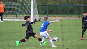 Boys Going For Ball Resized