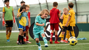 Girl With GK Kit Kicking Ball